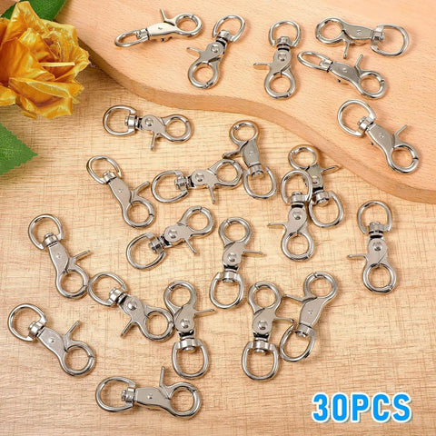 30 Pack Trigger Snap Hooks With Swivel Lobster Clasps Heavy Duty Zinc Alloy Lanyard Clips on wooden surface