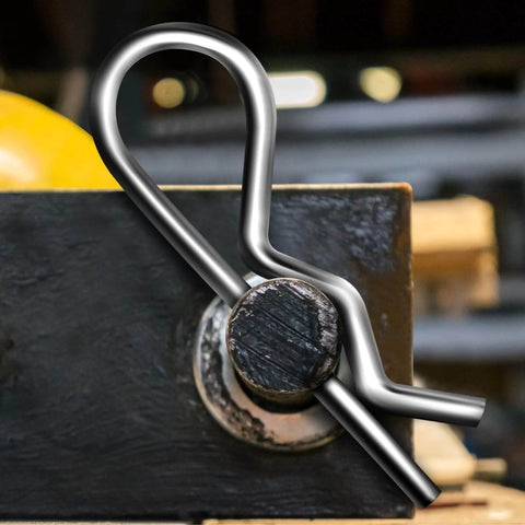 Close-up of a cotter pin from the 150 Pcs Cotter Pin Assortment Kit with R Shape Hitch Pin Clips installed on a metal hinge.