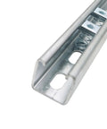 Close-up of durable zinc-plated 3/8-16 strut channel nuts installed on a Unistrut, showing spring mounting for steel framing.