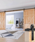 16 FT Double Door Sliding Barn Door Hardware Track Kit with basic J pulley installed on wooden doors in a modern room
