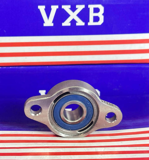 12mm Miniature Flanged Stainless Steel Mounted Bearing Block displayed against a blue VXB background.