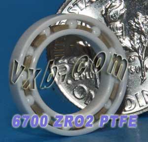 6700 Full Ceramic Bearing 10x15x3 Thin Section Ball Bearing shown with a quarter for size comparison.