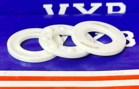 Full Ceramic 51102 ZrO2 Thrust Ball Bearing 15x28x9mm - componentes cerámicos blancos sobre un fondo colorido.