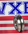 Stainless Steel RM2ZZ 3/8" V-Groove Guide Bearing SSW2-ZZ SSRM2ZZ sobre fondo con logo VXB.