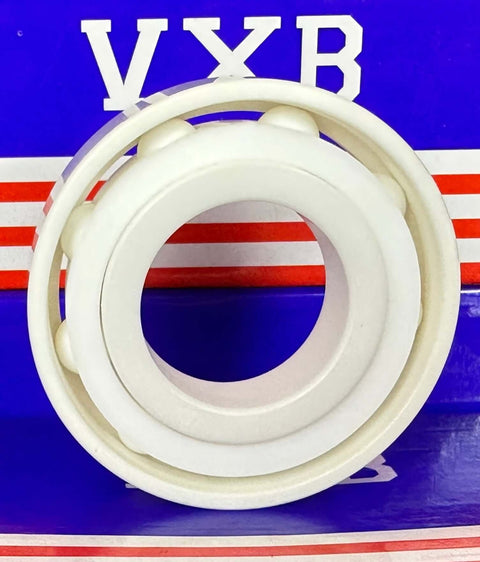 7206 Roulement à billes en céramique ZrO2 30x62x16mm sur fond bleu et rouge.