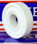 6304 ZrO2 Full Ceramic Ball Bearing displayed on a colorful background, showing its unique white ceramic design.
