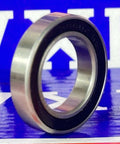 S6802-2RS Hybrid Ceramic Ball Bearing 15x24x5mm Rubber Sealed side view on a blue background.