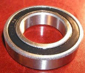 Sprocket Carrier Honda XL600 RD/RF/LMF 84-86 Bearing shown from the side on a red surface.