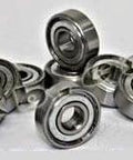 10-Pack R8PP Ball Bearings 8x22x7mm - Miniature arranged on a surface showcasing their double metal shields and carbon steel construction.