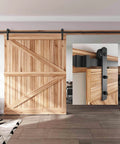 12 FT Heavy Duty Sliding Barn Door Hardware Track Kit with straight pulley, installed on wood door, black powder-coated steel