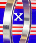 6819-2RS Sealed Bearing 95x120x13mm side view showing chrome steel outer ring against a blue and red background.
