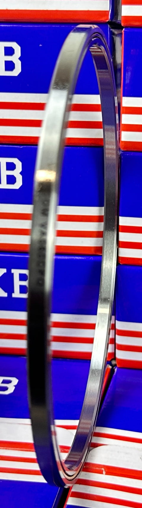 VA060CP0 Thin Section Bearing 6" x 6-1/2" x 1/4" - Slim Design showcased against a red and blue background.