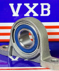 17mm Bore Miniature Stainless Steel Pillow Block Mounted Bearing on display with a blue seal and grey housing.