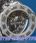 Front view of 6700 Full Ceramic Bearing 10x15x3 Thin Section Ball Bearing next to a coin for size reference.