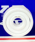 627 Full Ceramic ZrO2 Ball Bearing 7x22x7mm Miniatura exibida em um fundo azul.