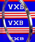 VA050CP0 Thin Section Bearing 5" x 5-1/2" x 1/4" inch displayed on a colorful background, showcasing chrome steel construction.