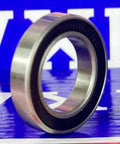 S6802-2RS Hybrid Ceramic Bearing 15x24x5mm Sealed ABEC-5 Si3N4 side view on colorful background.